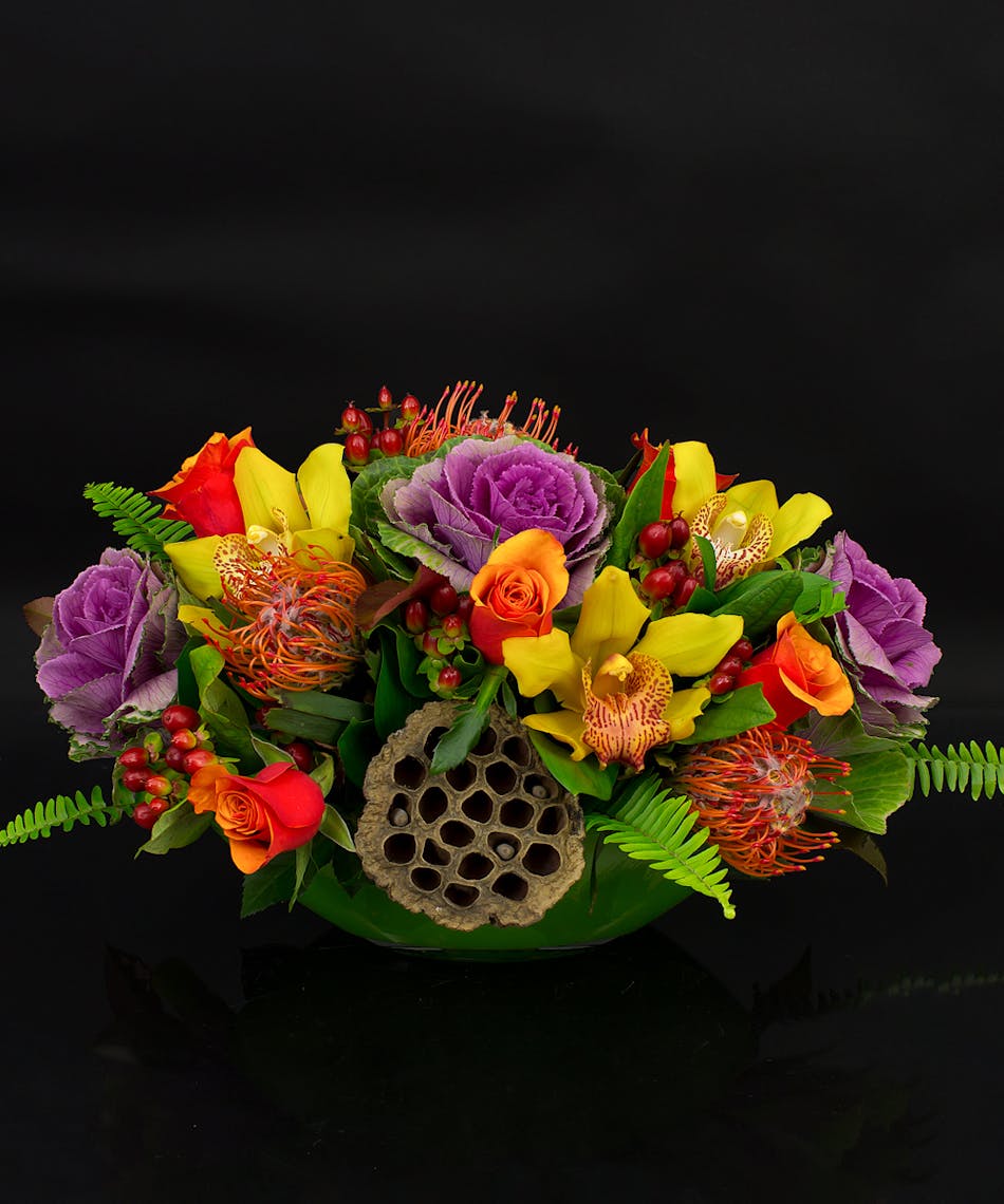 Our Sebago arrangement mimics the beauty of the lake as it mirrors natures Autumn splendor.